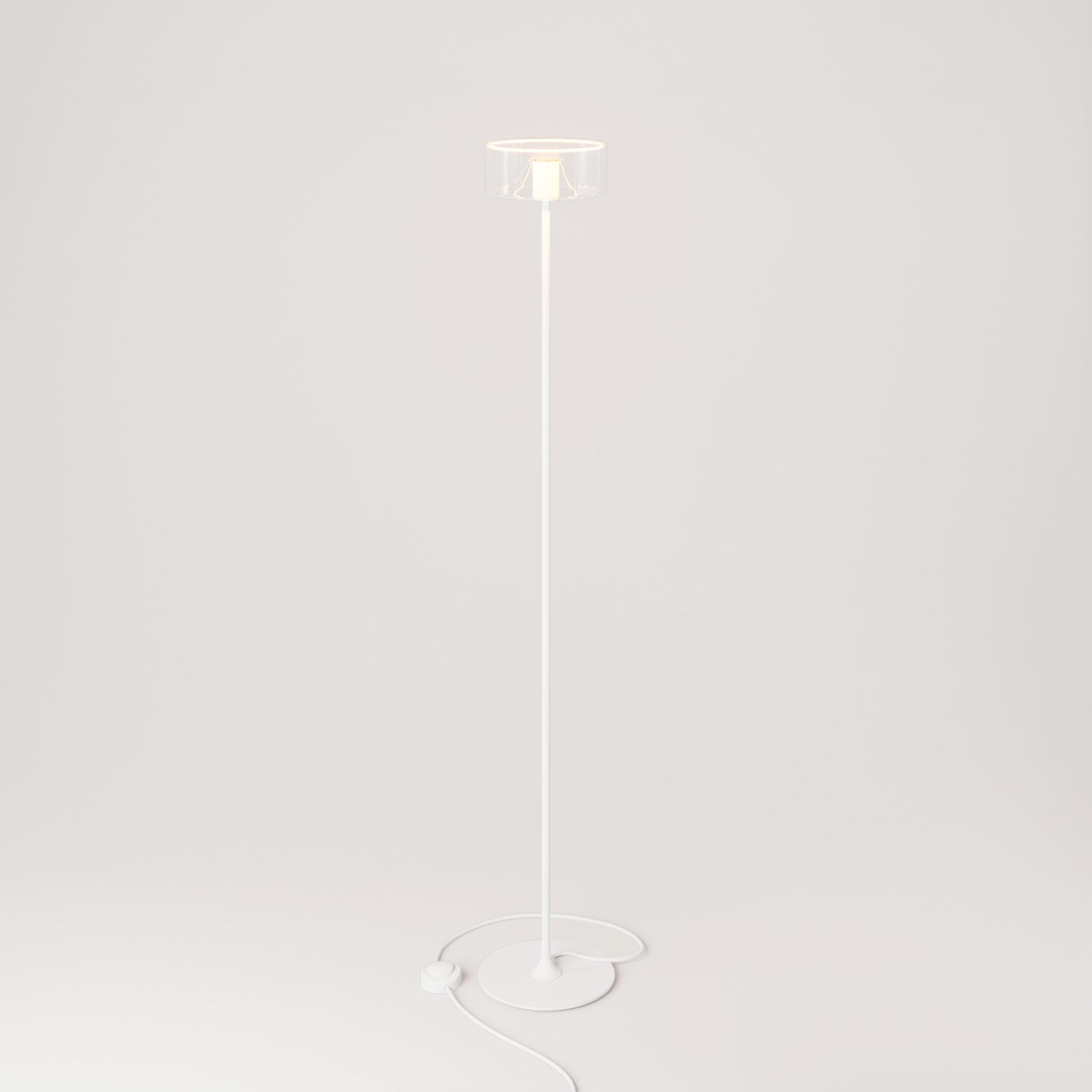 MAG-Y vloerlamp met ronde metalen voet en transparante Ghost lamp